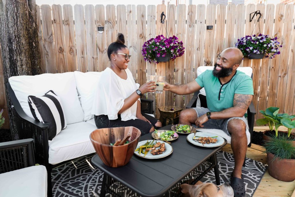Husband and Wife enjoying backyard decor