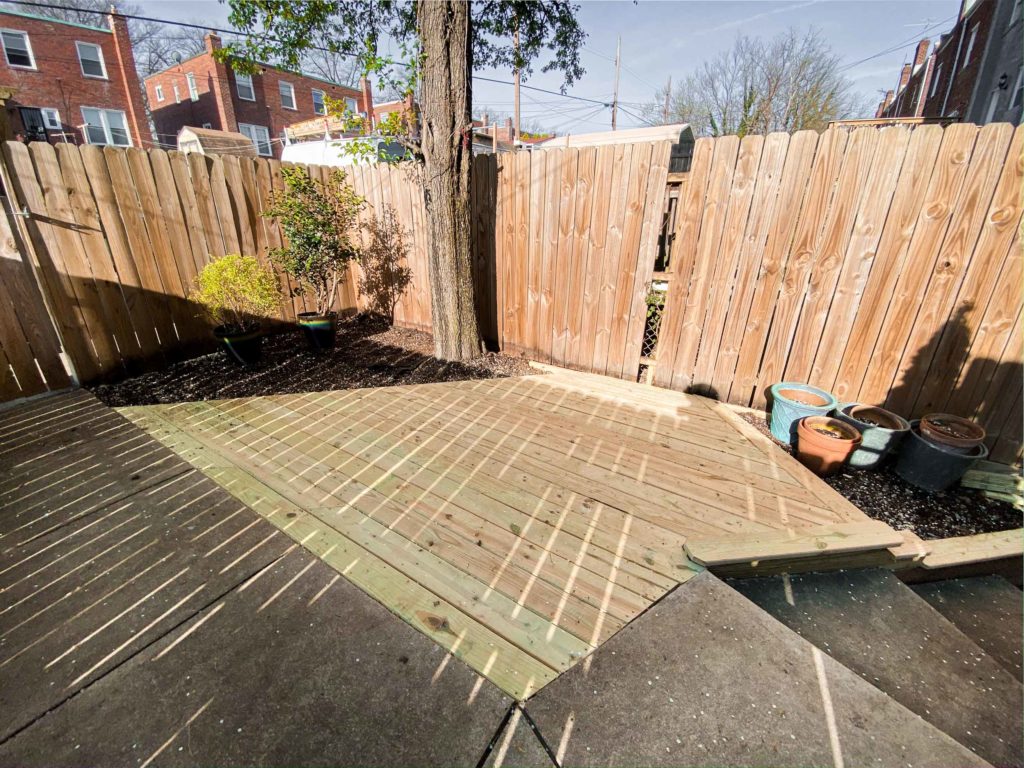 Before Photo of Backyard with new patio wood flooring
