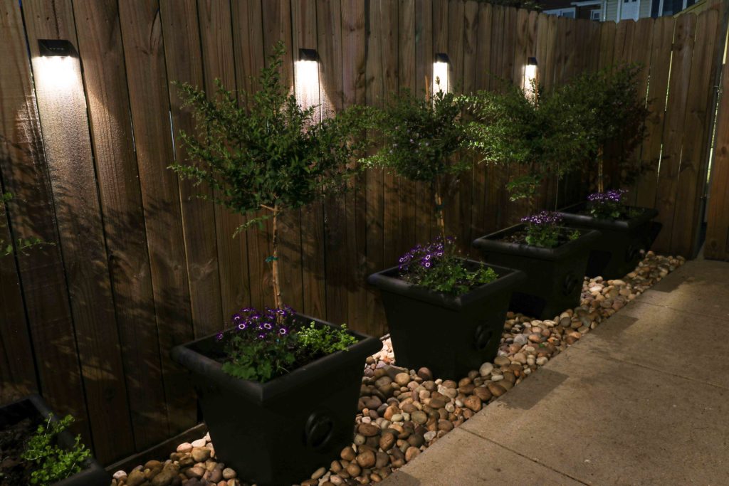 Solar Fence Deck Lighting between Large Planters