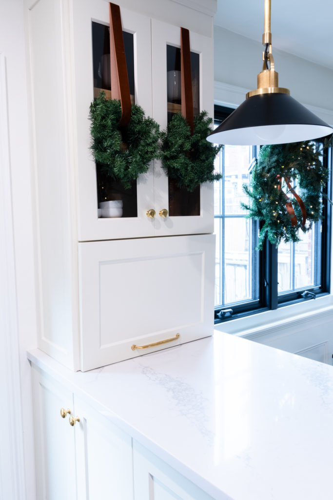Wreaths hanging from cabinet doors