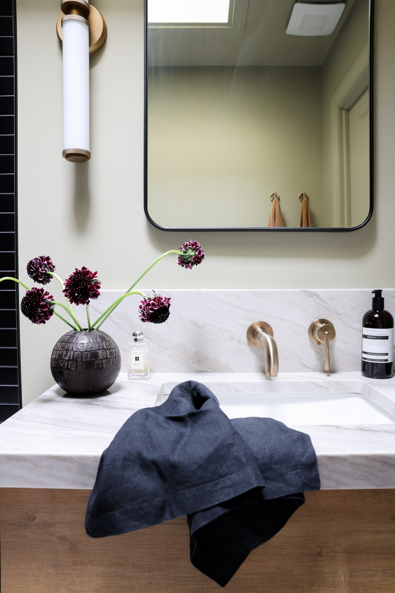 Floating vanity with Trinsic® Single Handle Wall Mount Bathroom Faucet Trim In Champagne Bronze